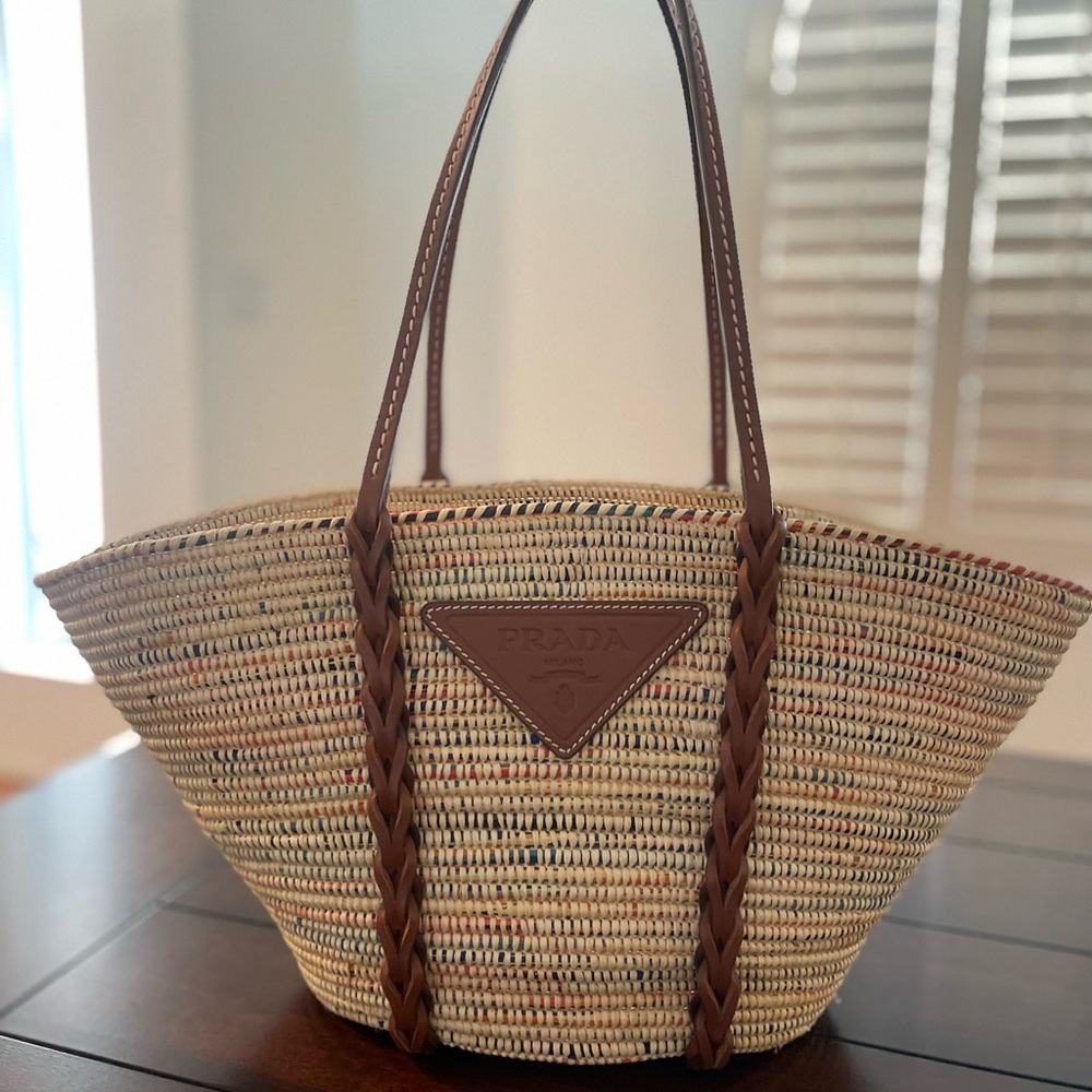 Prada straw tote. Only used once. Excellent condition.